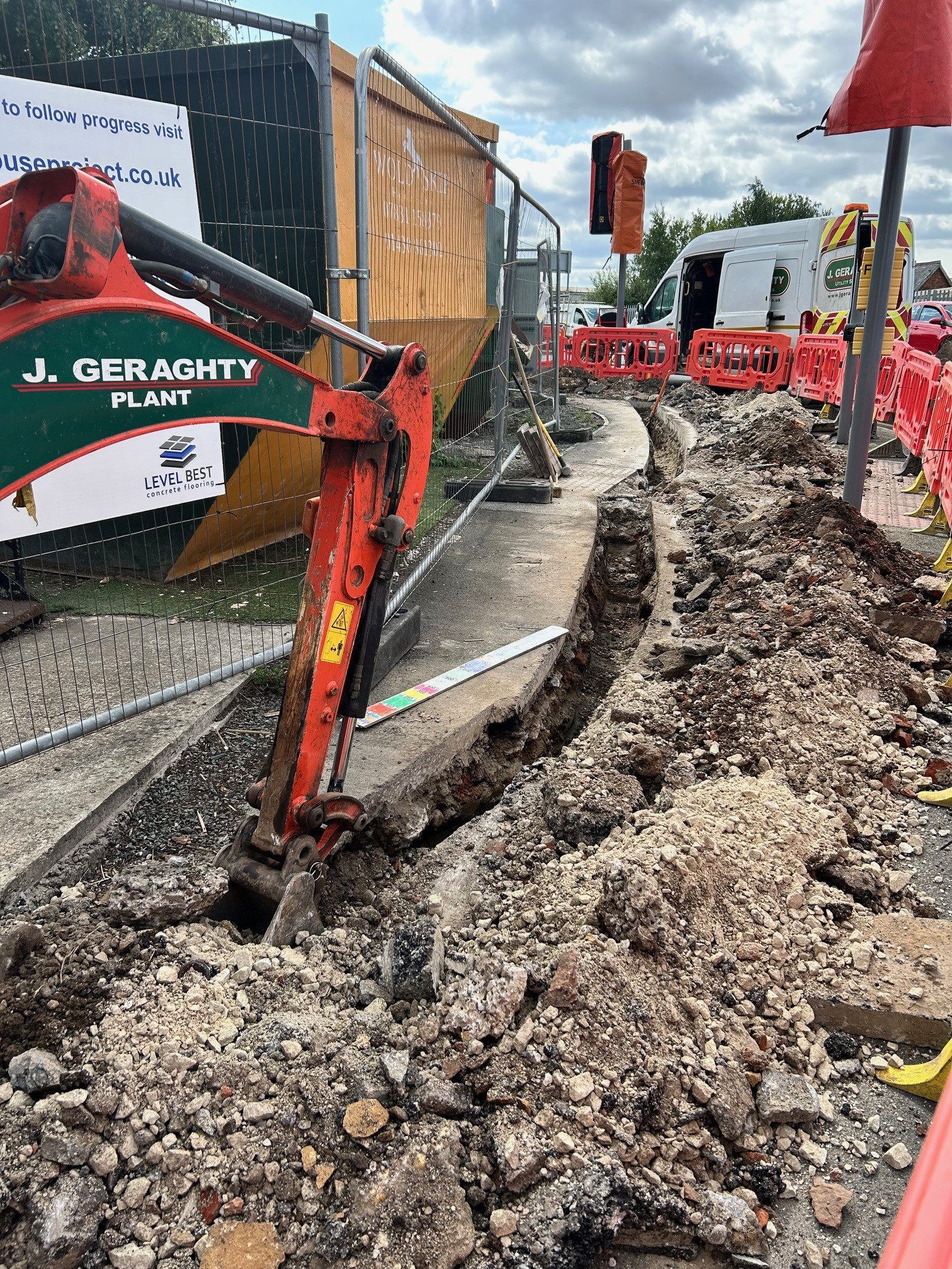 Sign posts moved to cater for new office extension at Hartley House